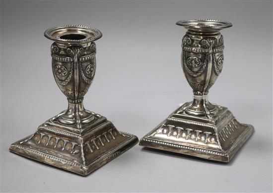 A pair of Victorian silver dwarf candlesticks, Hawksworth, Eyre & Co, Sheffield, 1876, 11cm.